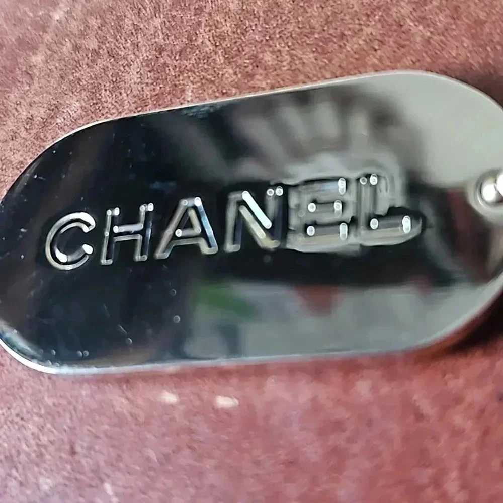 Chanel gold foil inlaid green dog tag